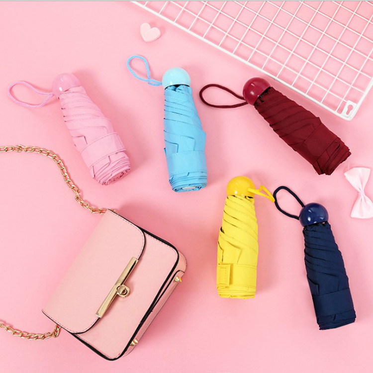Capsule Umbrella 50 % de réduction Parapluie en caoutchouc noir Parapluie ultra-léger mini de poche Parapluie de protection solaire Parapluie parasol
